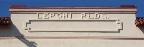 Stucco letters before restoration