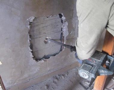 Drilling a hole in concrete wall