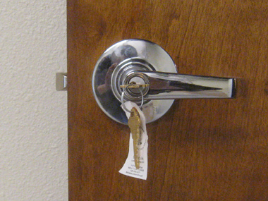 Bright chrome hardware added to a door.