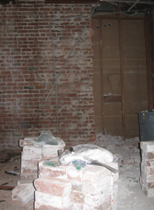 Interior brick wall after partial demolition to remove an unsafe portion.